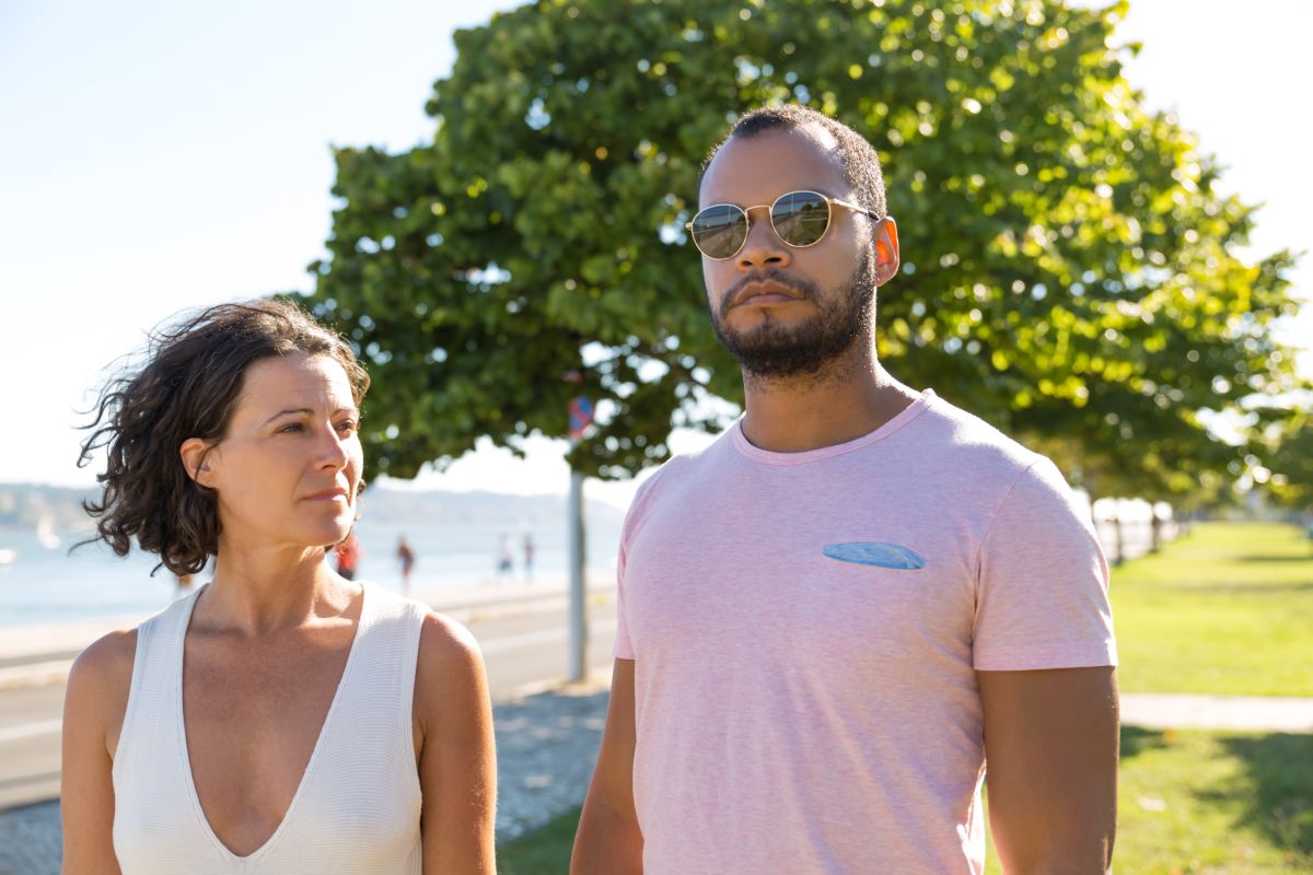 multiethnic couple walking